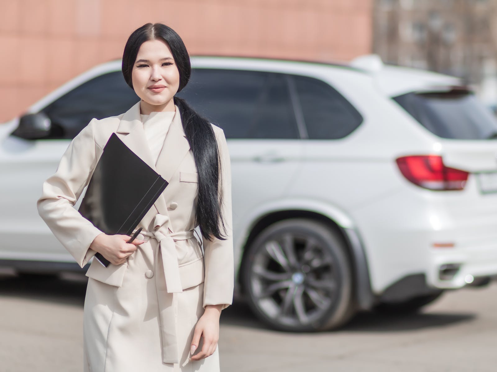 Woman in Beige Corporate Clothes Holding Black Folder, auto